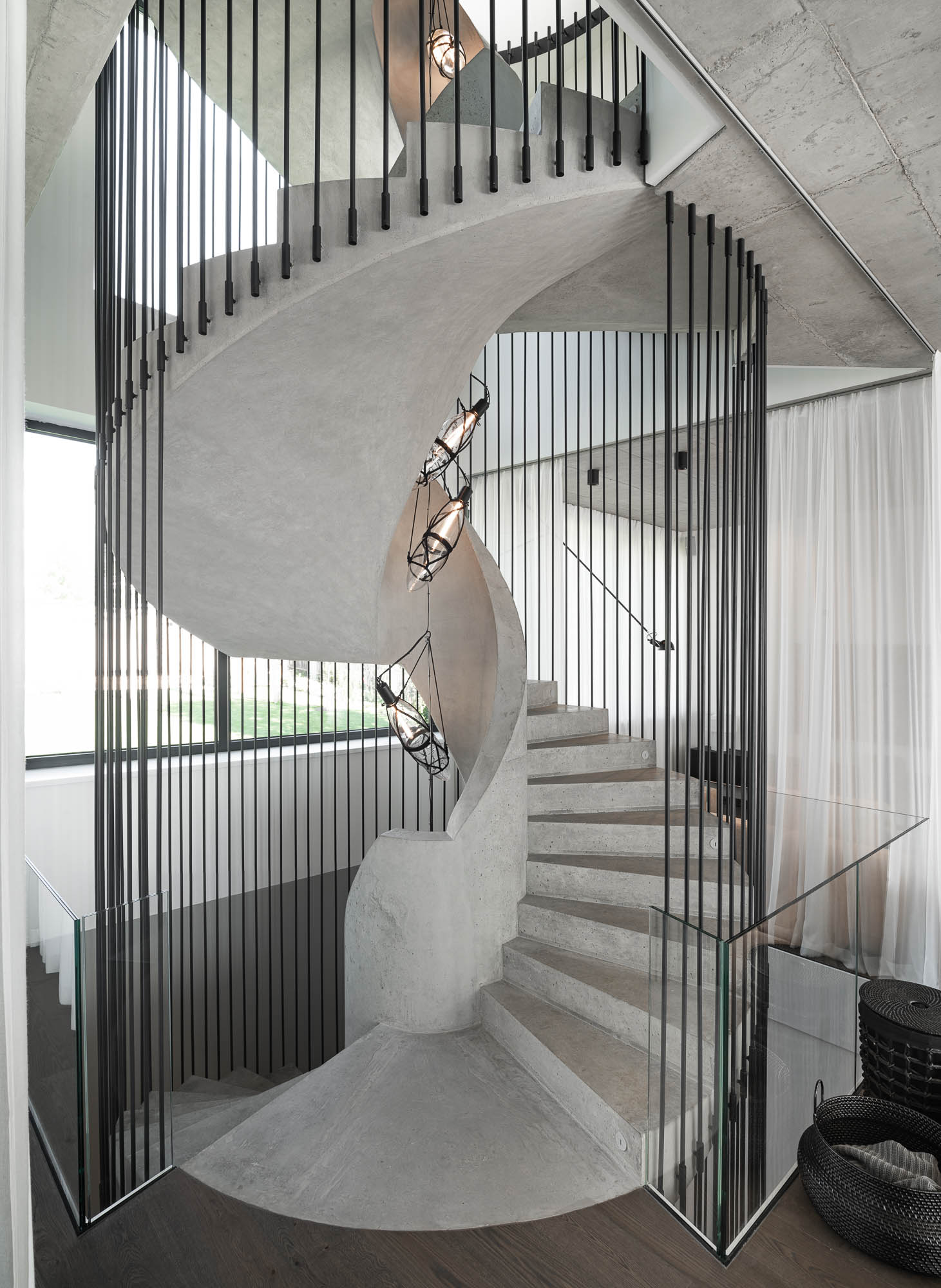 Villa Ohnivcova — curved concrete staircase monolith OOOOX Prague