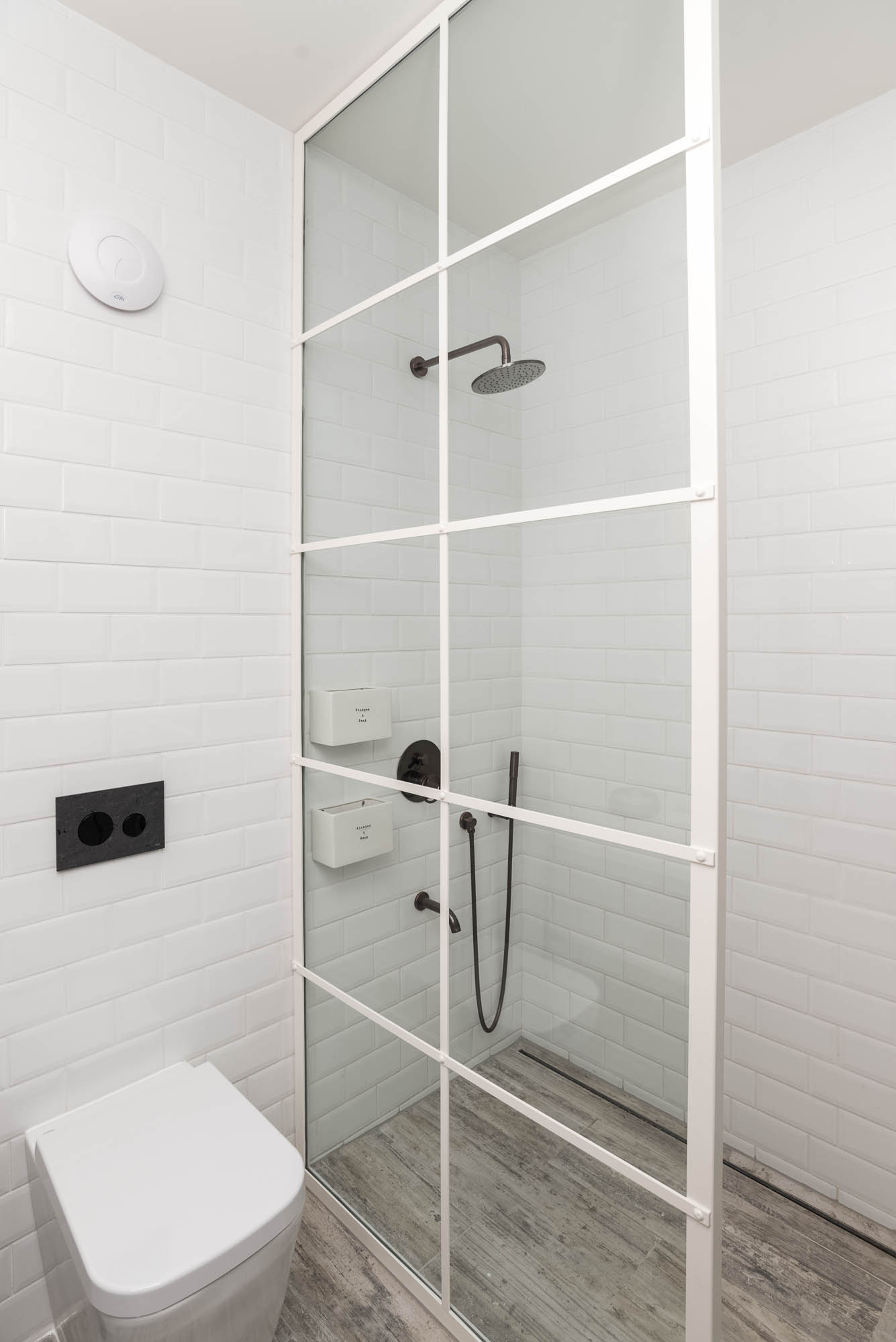 White bathroom BOX barn conversion shower white steel frame factory window glass partition metro subway tiles OOOOX