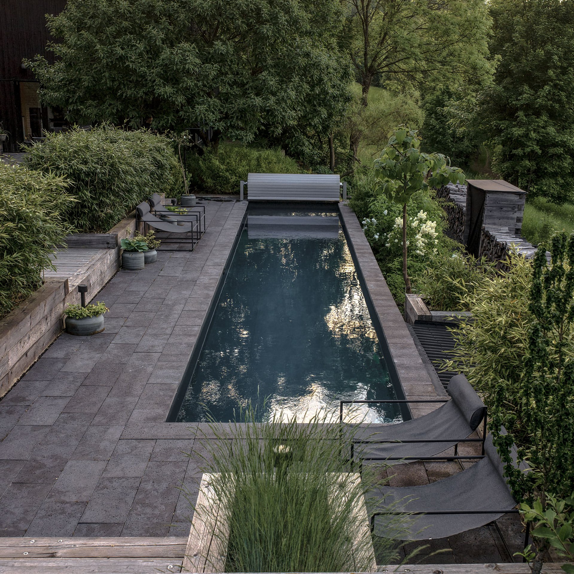 BOX barn conversion — view to the forest landscape, pool on the slope | OOOOX