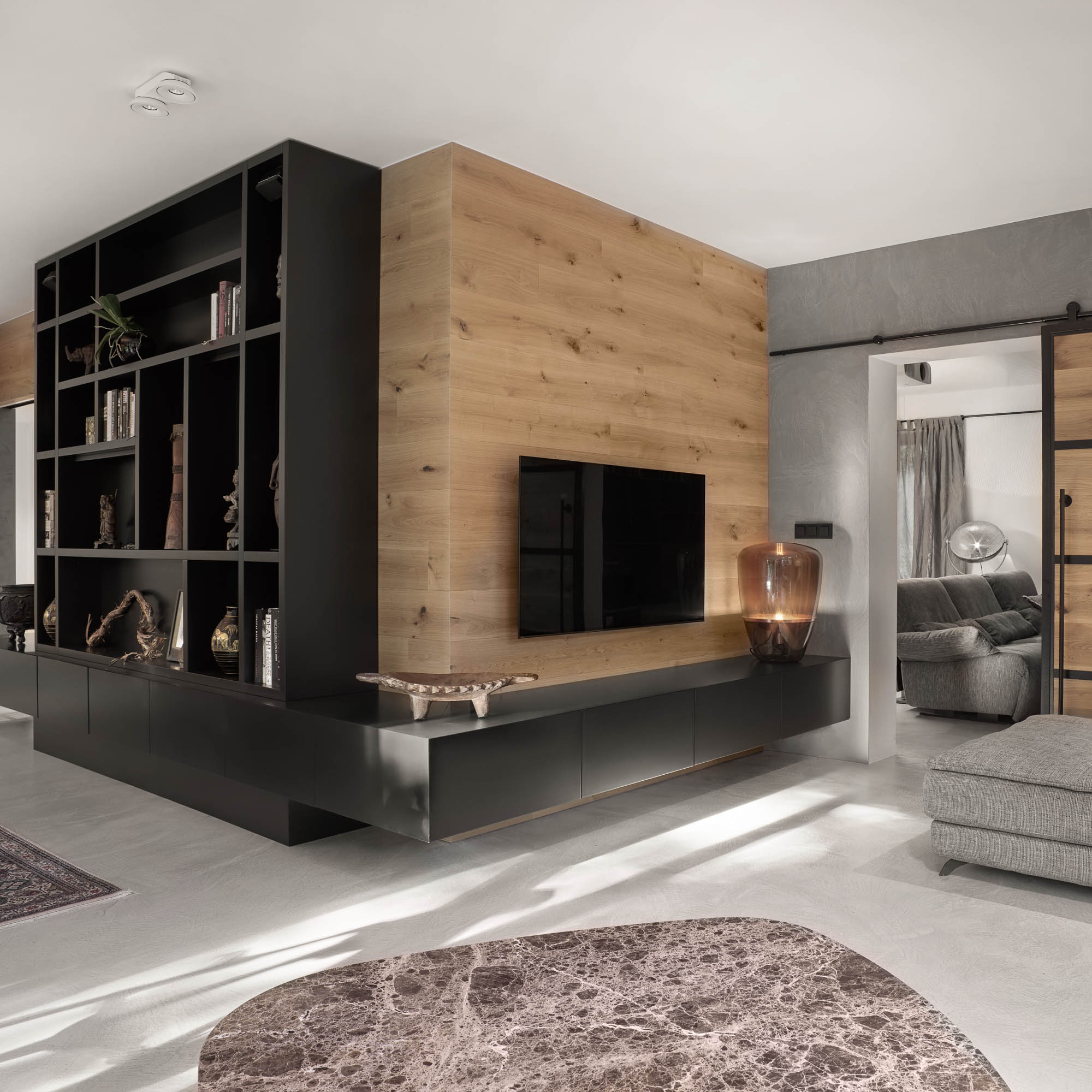 Living room dark open bookshelf oak TV wall panel barn-style sliding door dark marble coffee table OOOOX