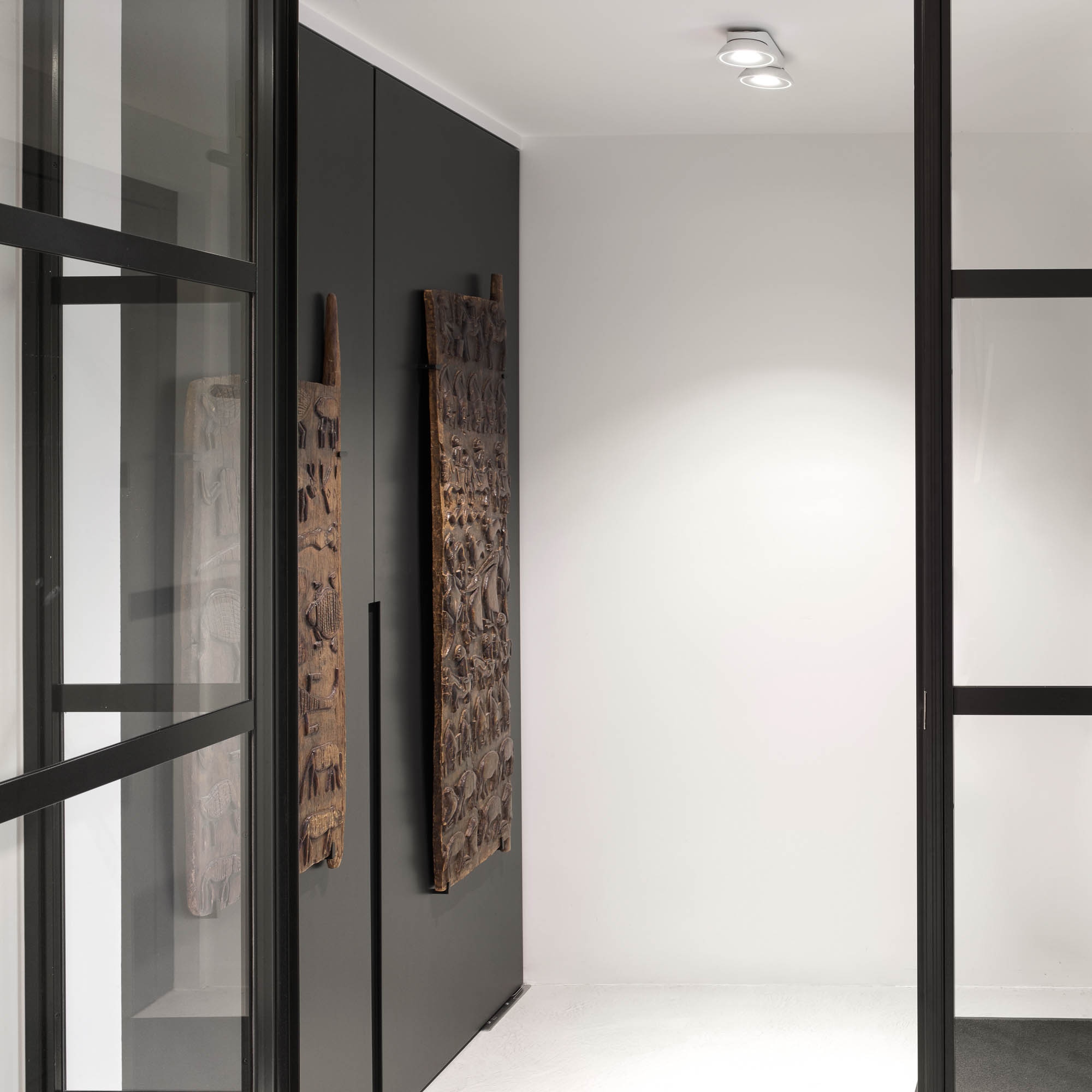 Entrance hall dark wardrobe two African carved wood tribal relief panels art collector's home OOOOX villa