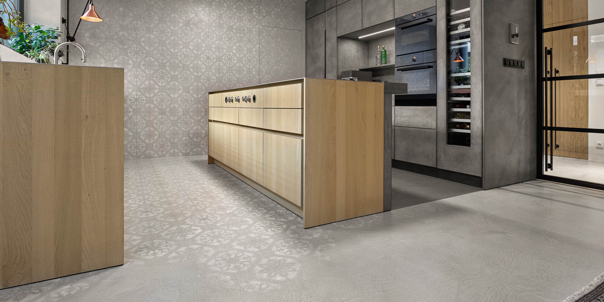 Kitchen from side entrance oak island patterned concrete stucco floor wall grey cabinet wine fridge OOOOX