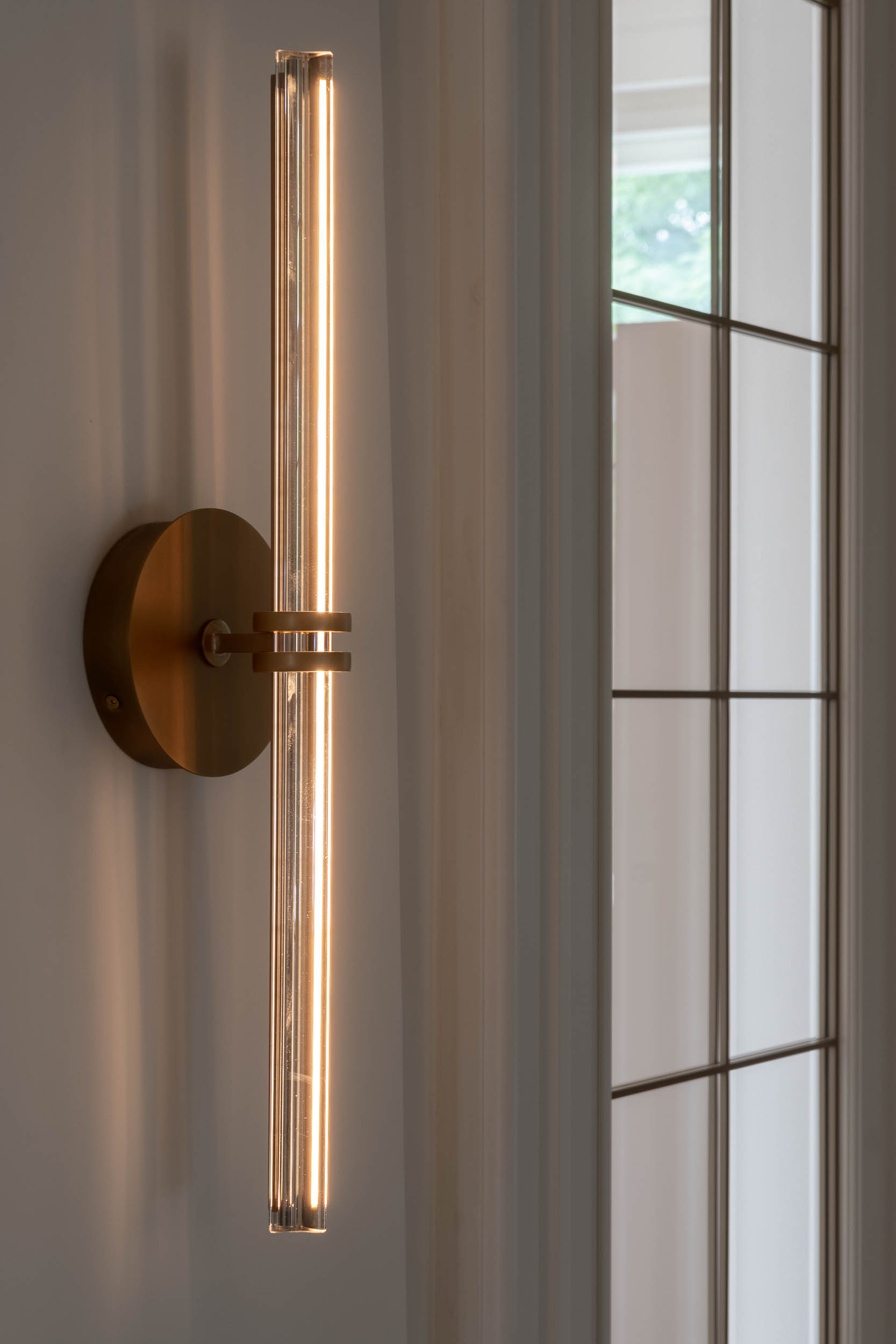 Detail of a delicate designer light fixture in the interior reconstruction of Villa Vinohrady | design by OOOOX