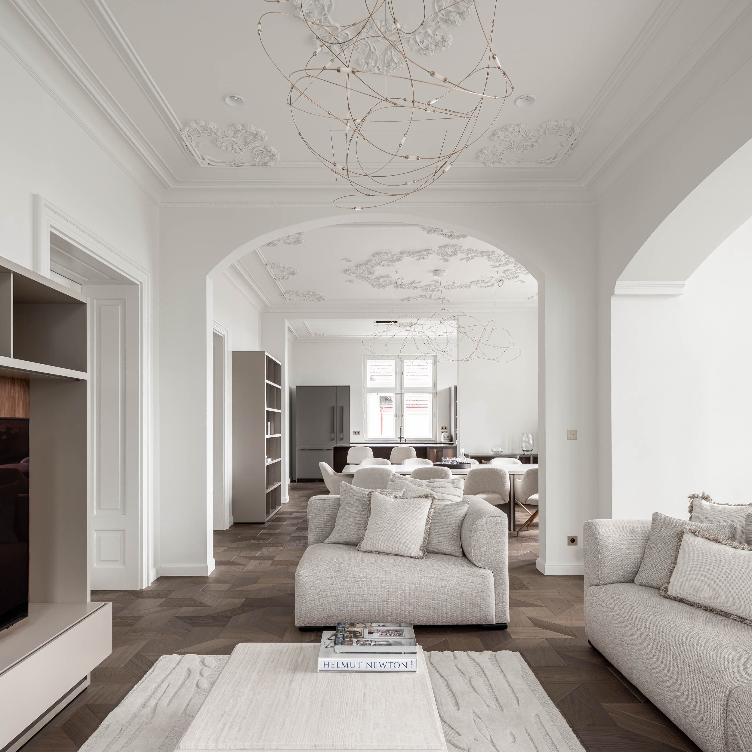 Living space of the minimalist interior reconstruction of Villa Vinohrady, stucco ceilings and delicate designer lighting | design by OOOOX