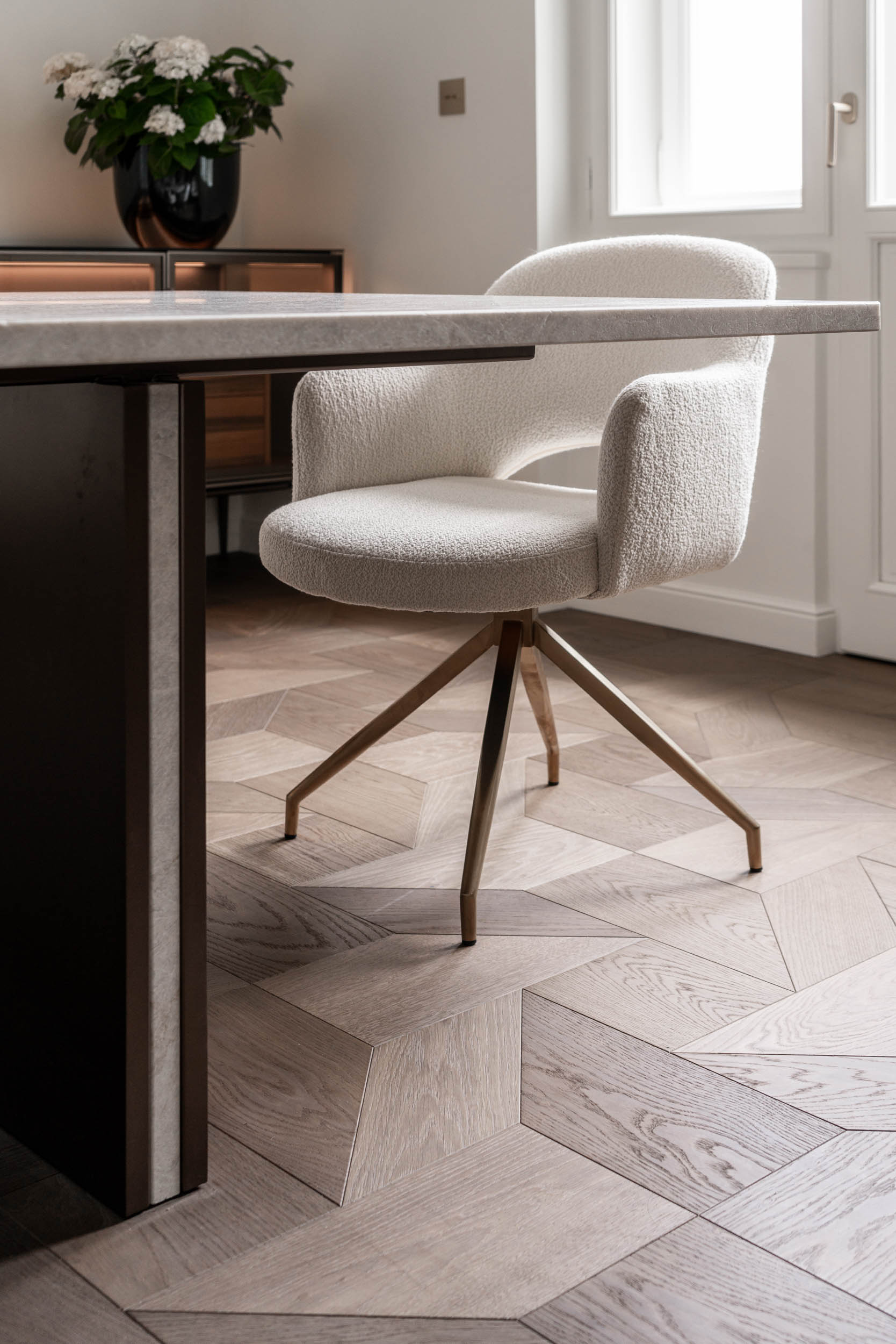 Detail of the dining table, upholstered designer dining chair and custom American walnut parquet flooring | Villa Vinohrady interior, reconstruction by OOOOX