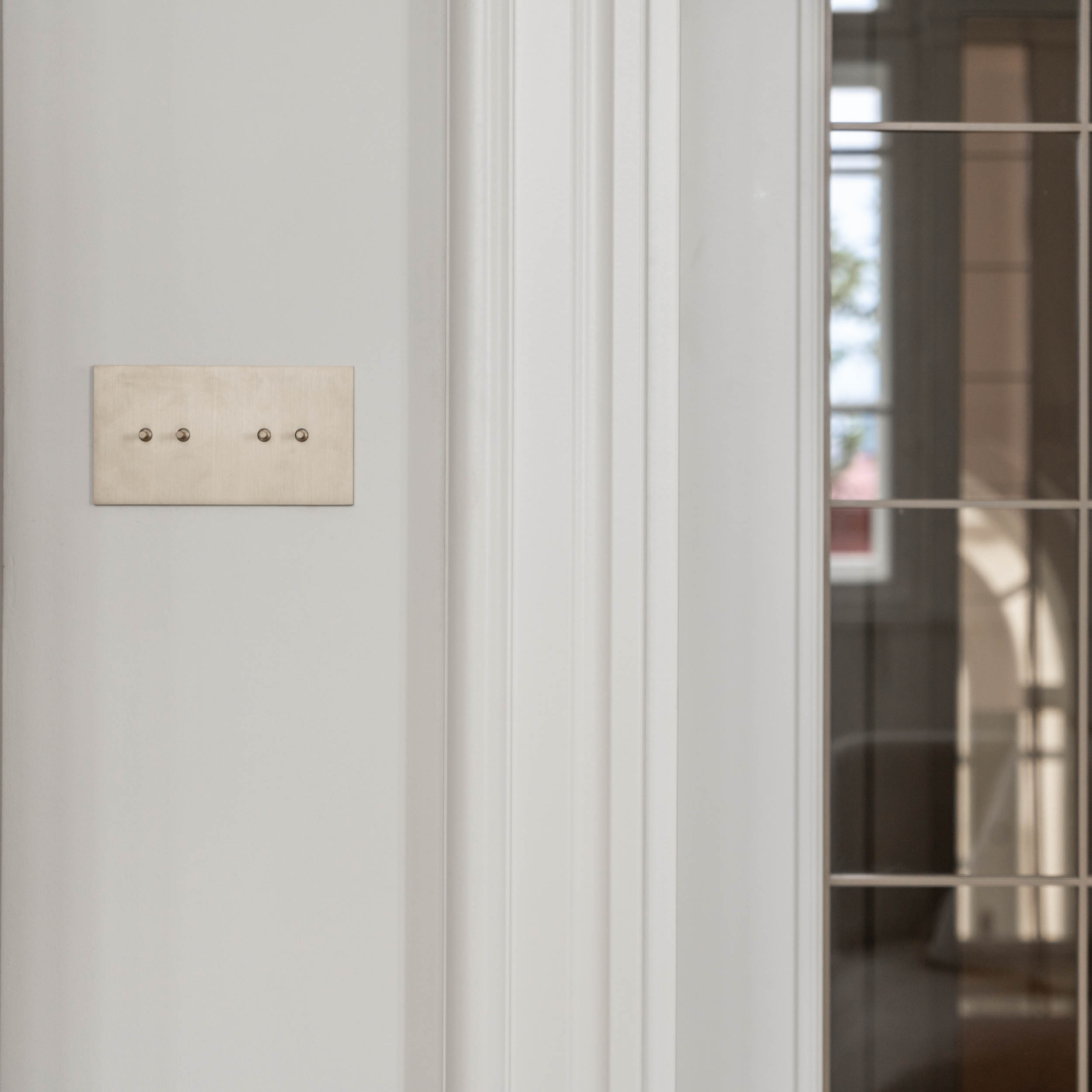 Designer minimalist switches in the interior reconstruction of Villa Vinohrady | OOOOX