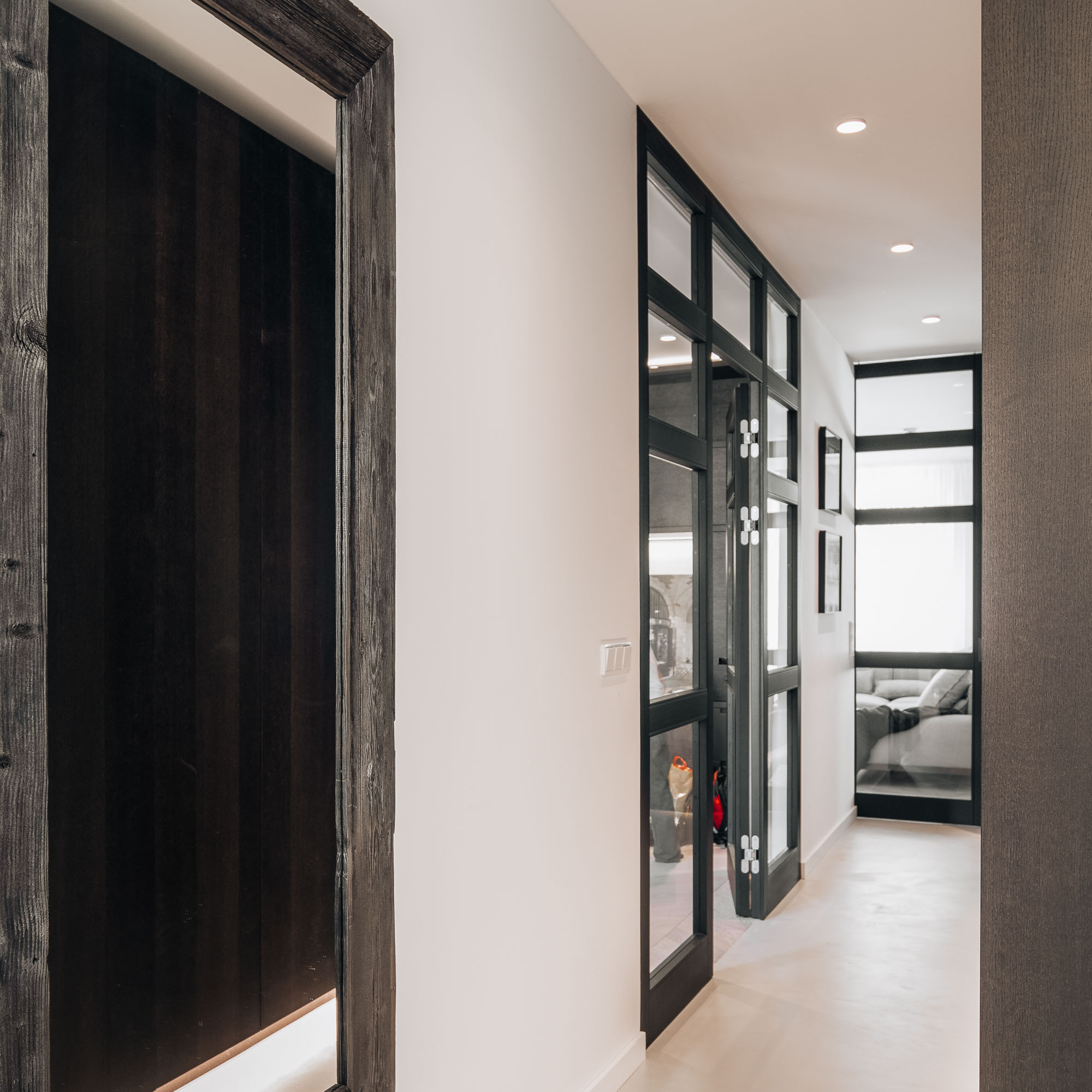 Prague apartment renovation – living area with timber-framed glazed partitions | OOOOX