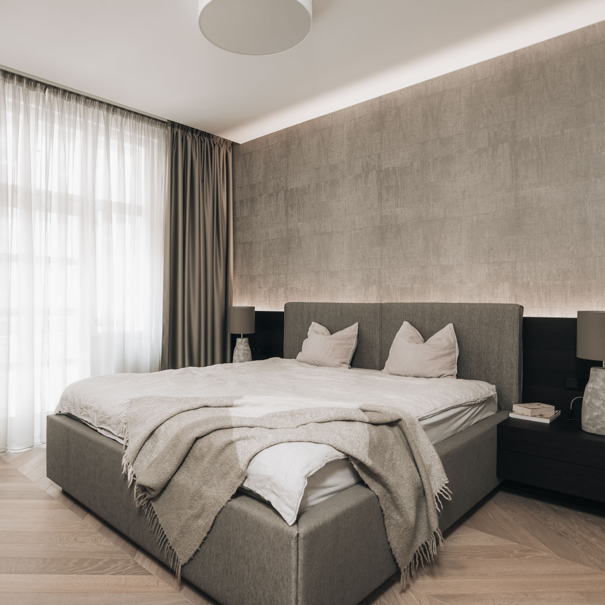 bedroom in renovated Letná apartment with wallpaper and indirect lighting | OOOOX