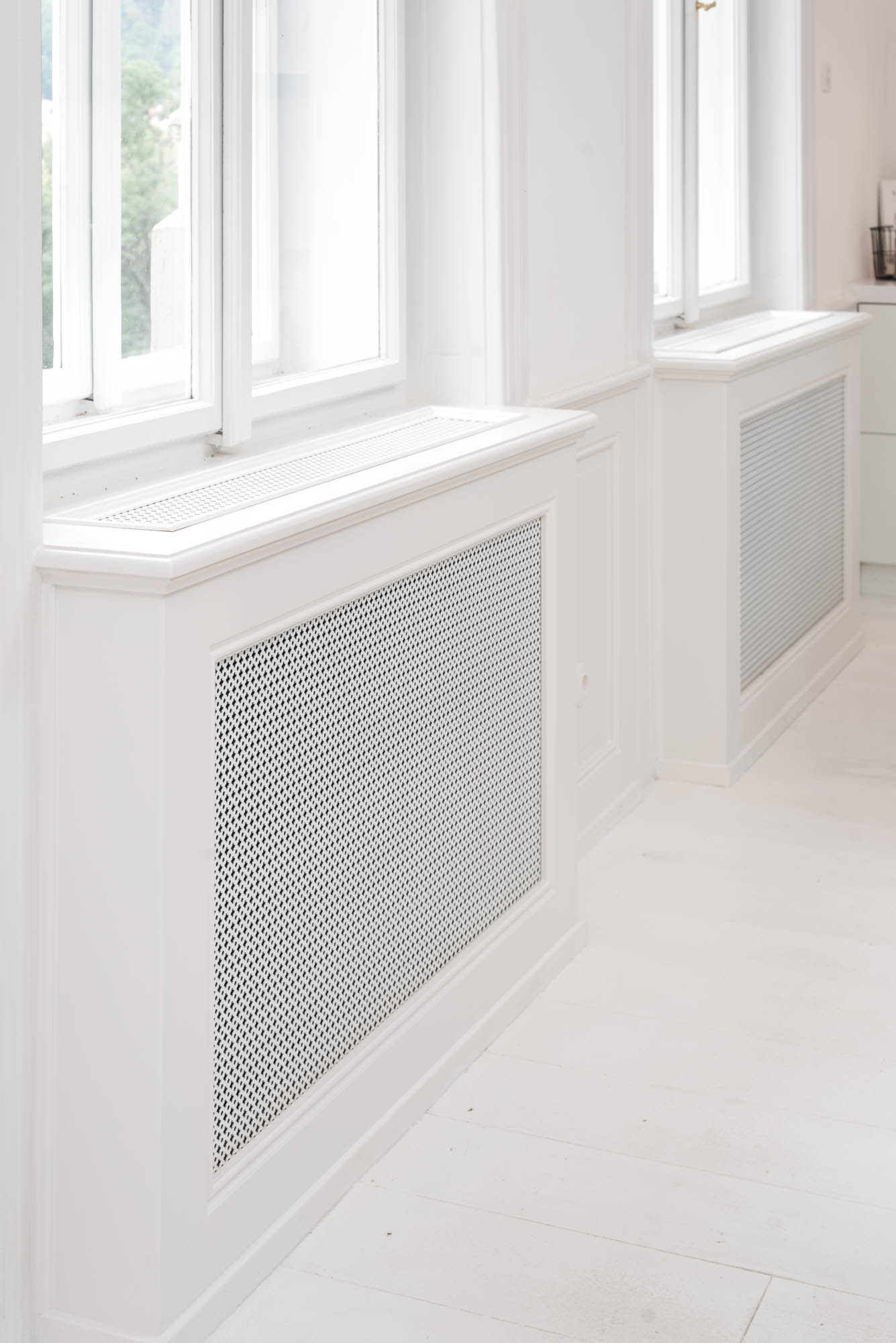 Detail of concealed radiators beneath historic window sills in the reconstruction of the TIVOLI Art Nouveau apartment | OOOOX
