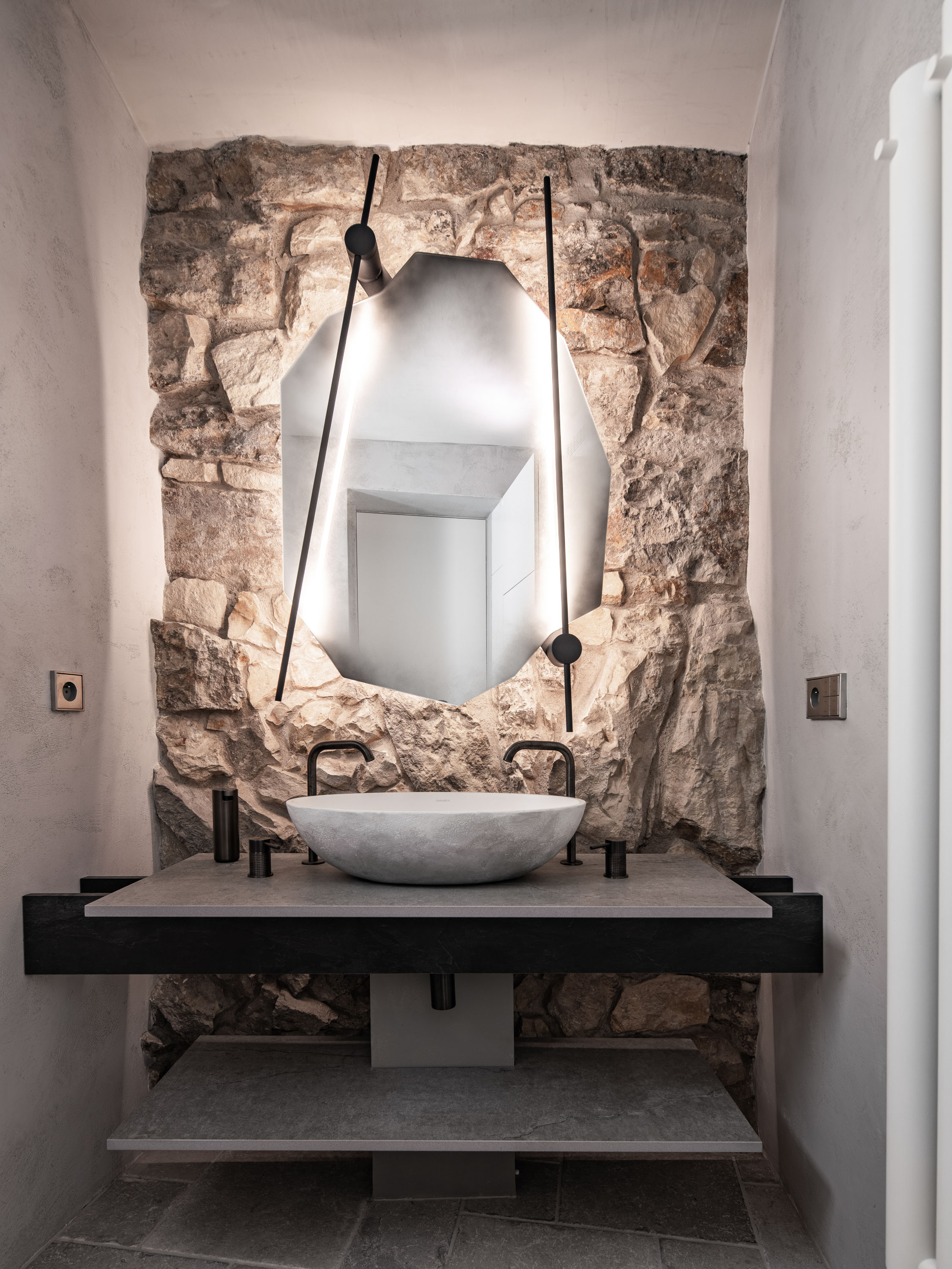 Image - (Gallery) En suite bathroom with an exposed stone wall - 01