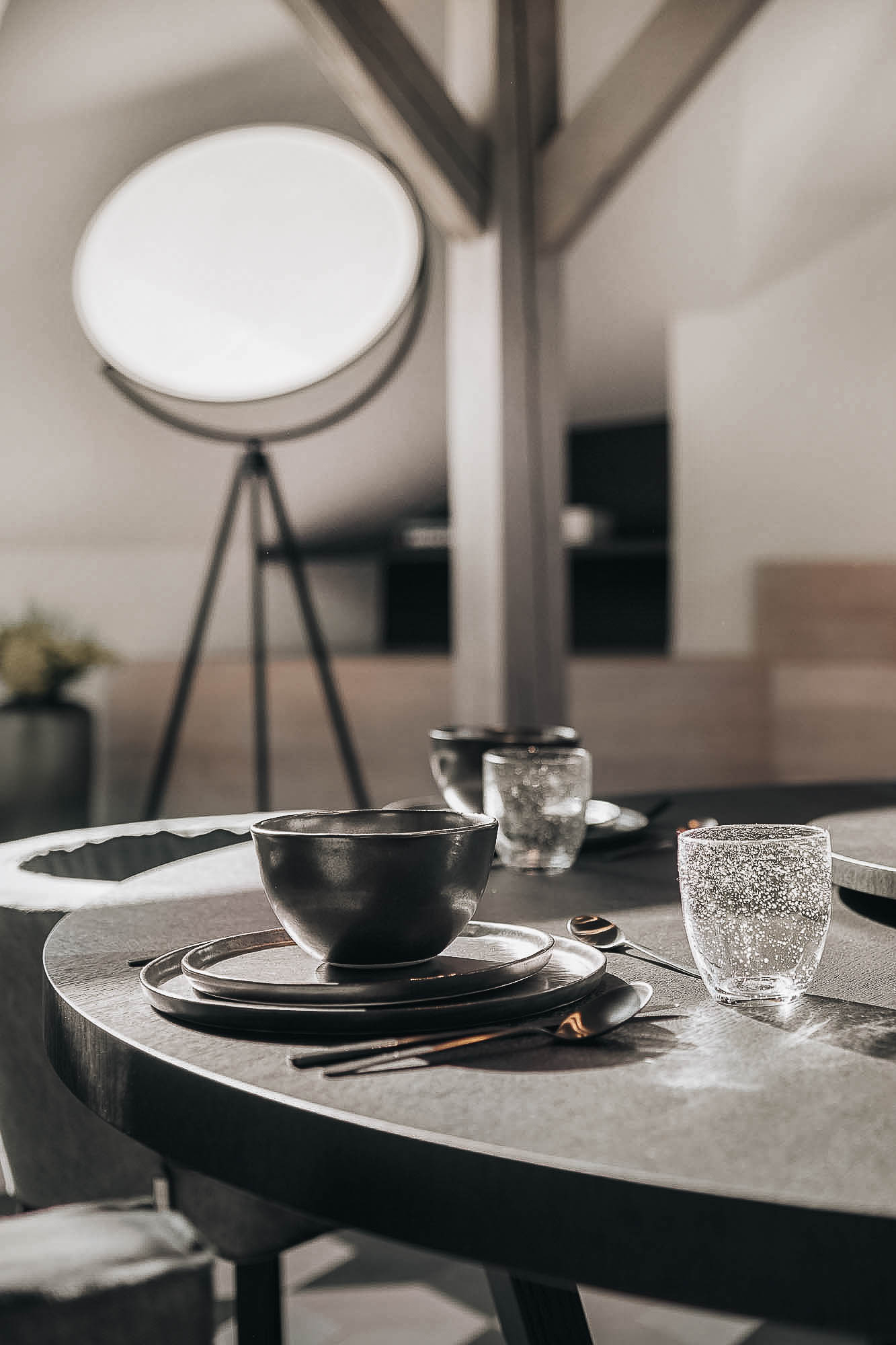 Detail of a circular dining table in the attic interior of the Josefov reconstruction by architects OOOOX
