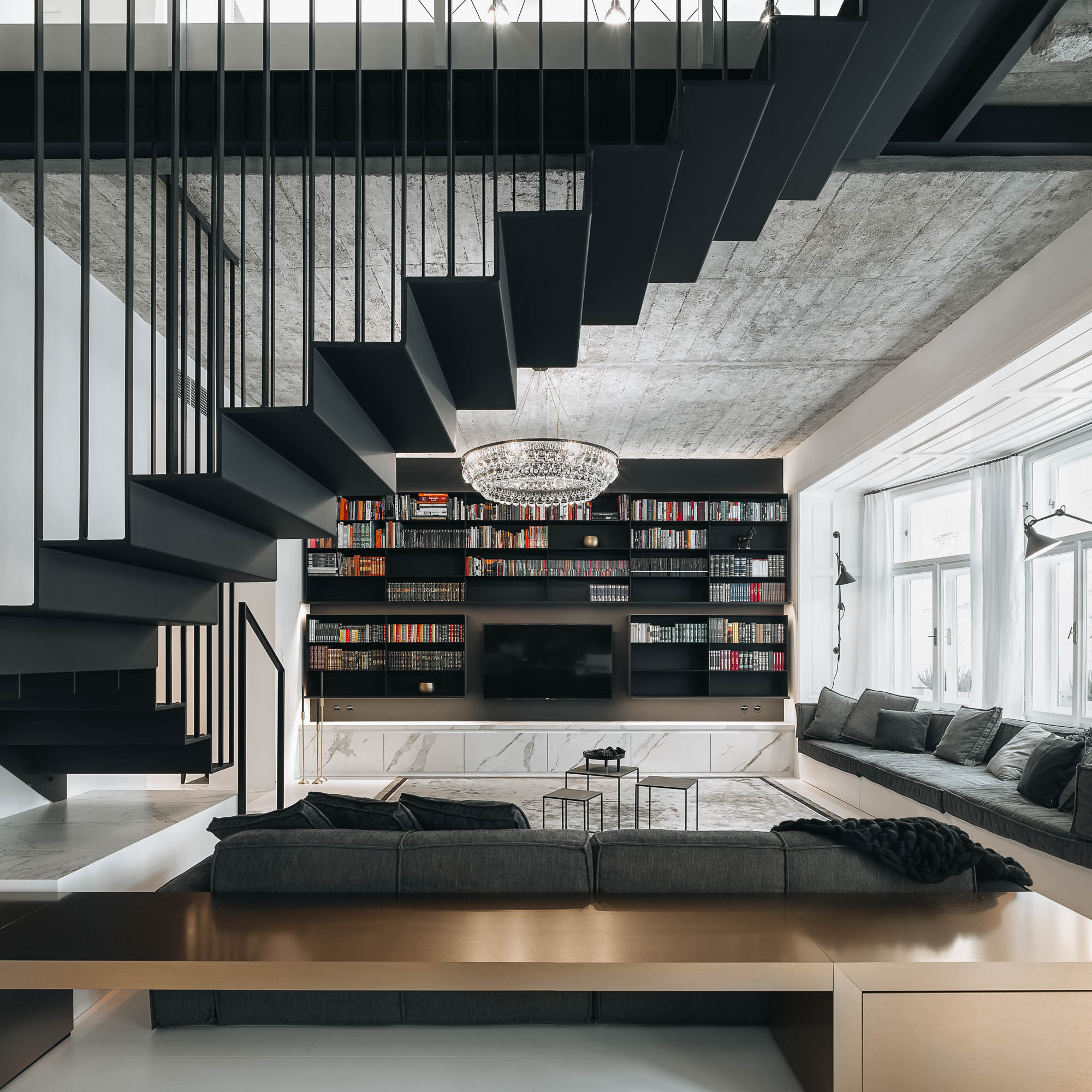 Living room oak sofa platform black floating staircase bookshelf chandelier bay window exposed brick OOOOX